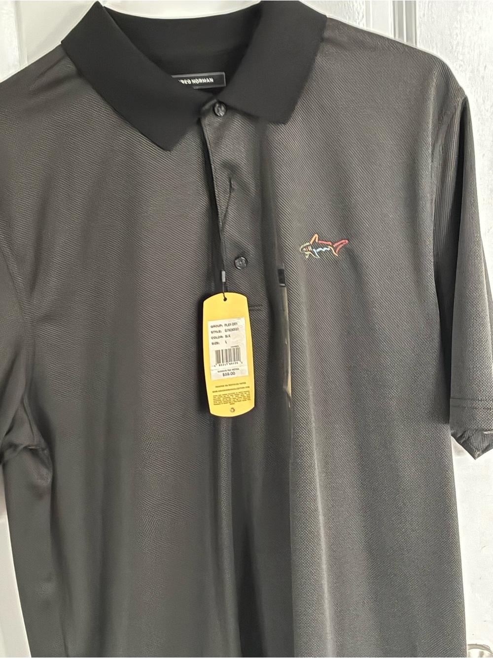 Greg Norman Collection Black Polo with Multi-Color Shark Logo
